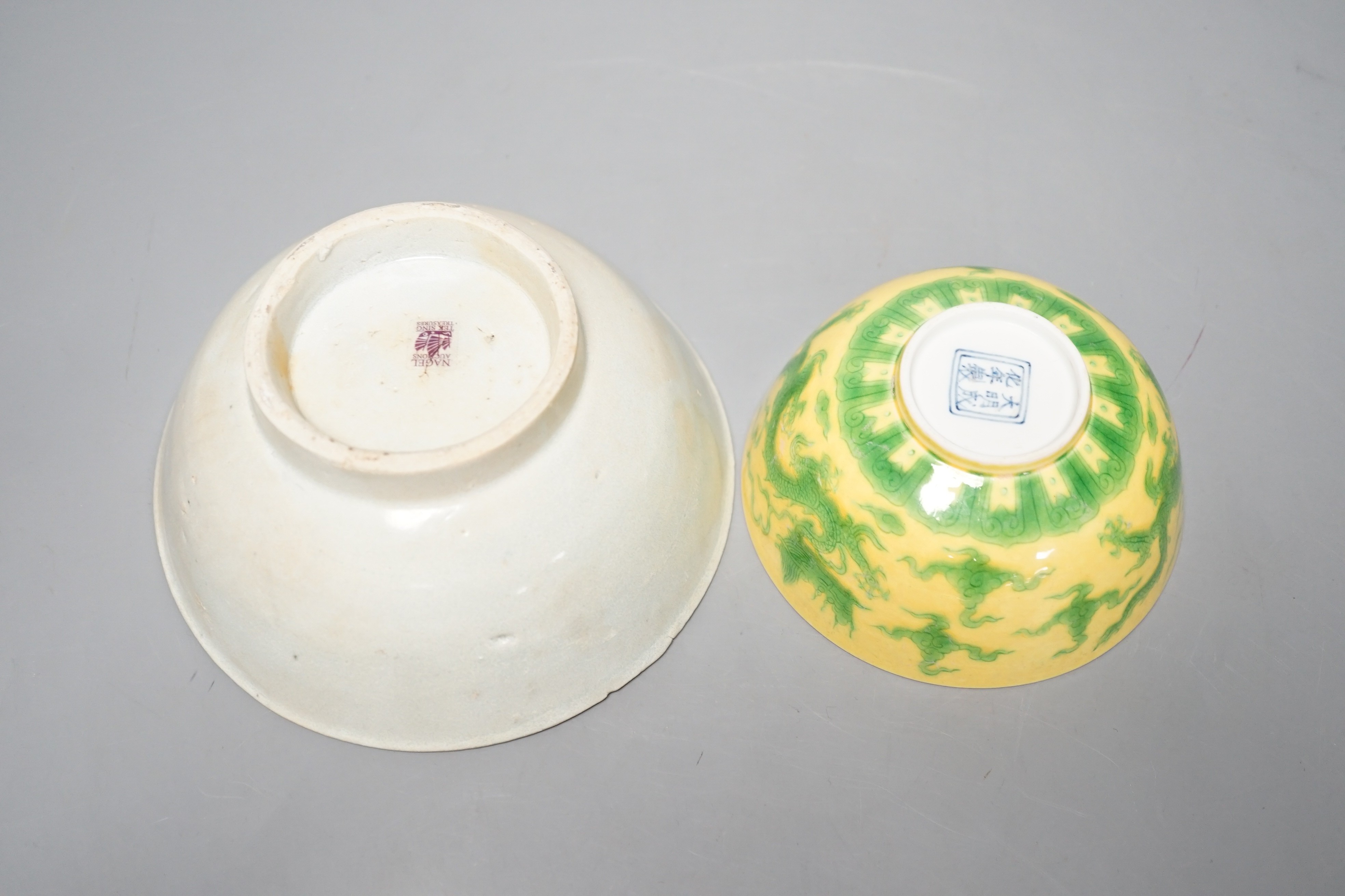 A Chinese Teksing cargo bowl c1820 and a yellow ground 'dragon' bowl. Largest 16cm diameter.